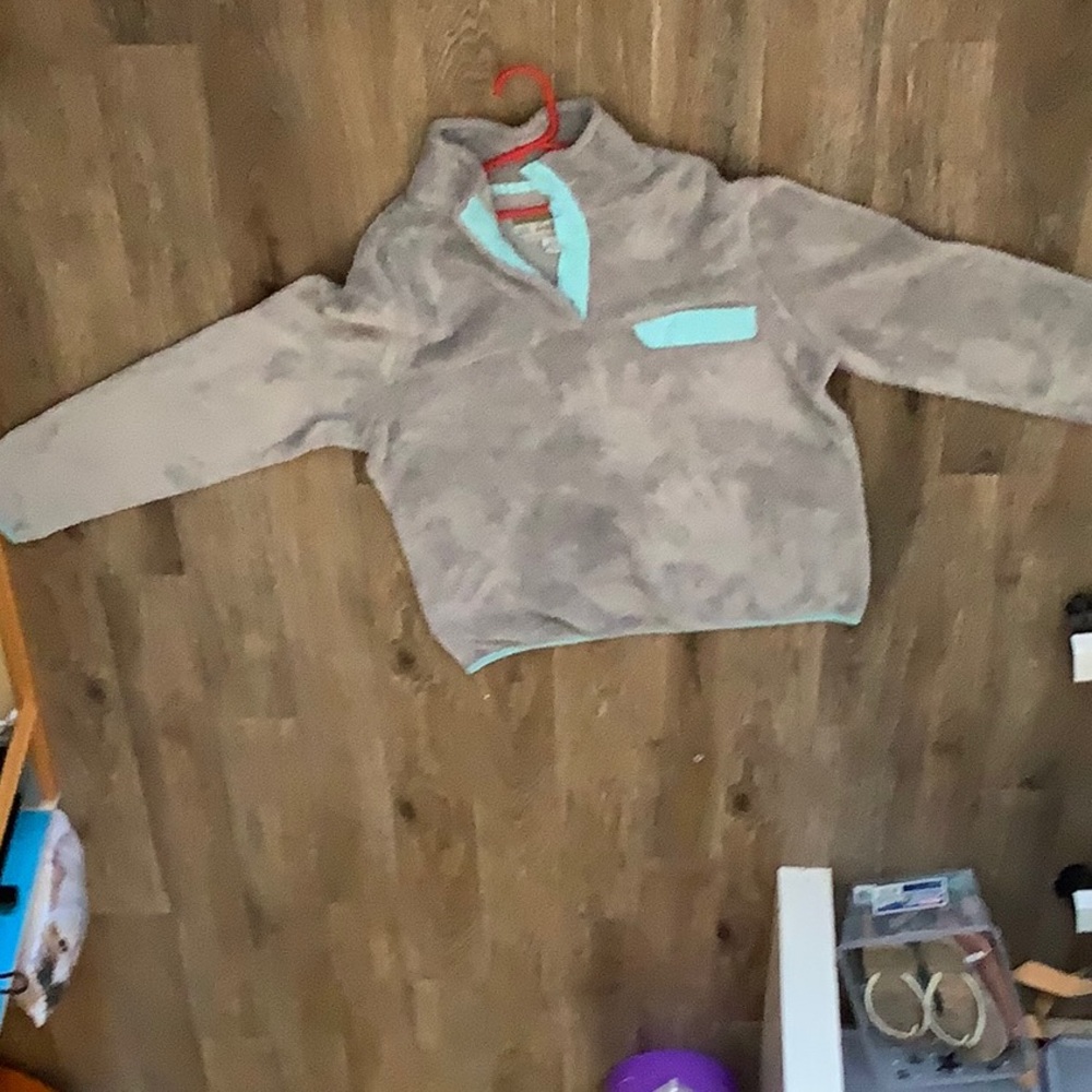 A Jacket with a pocket and button up neck